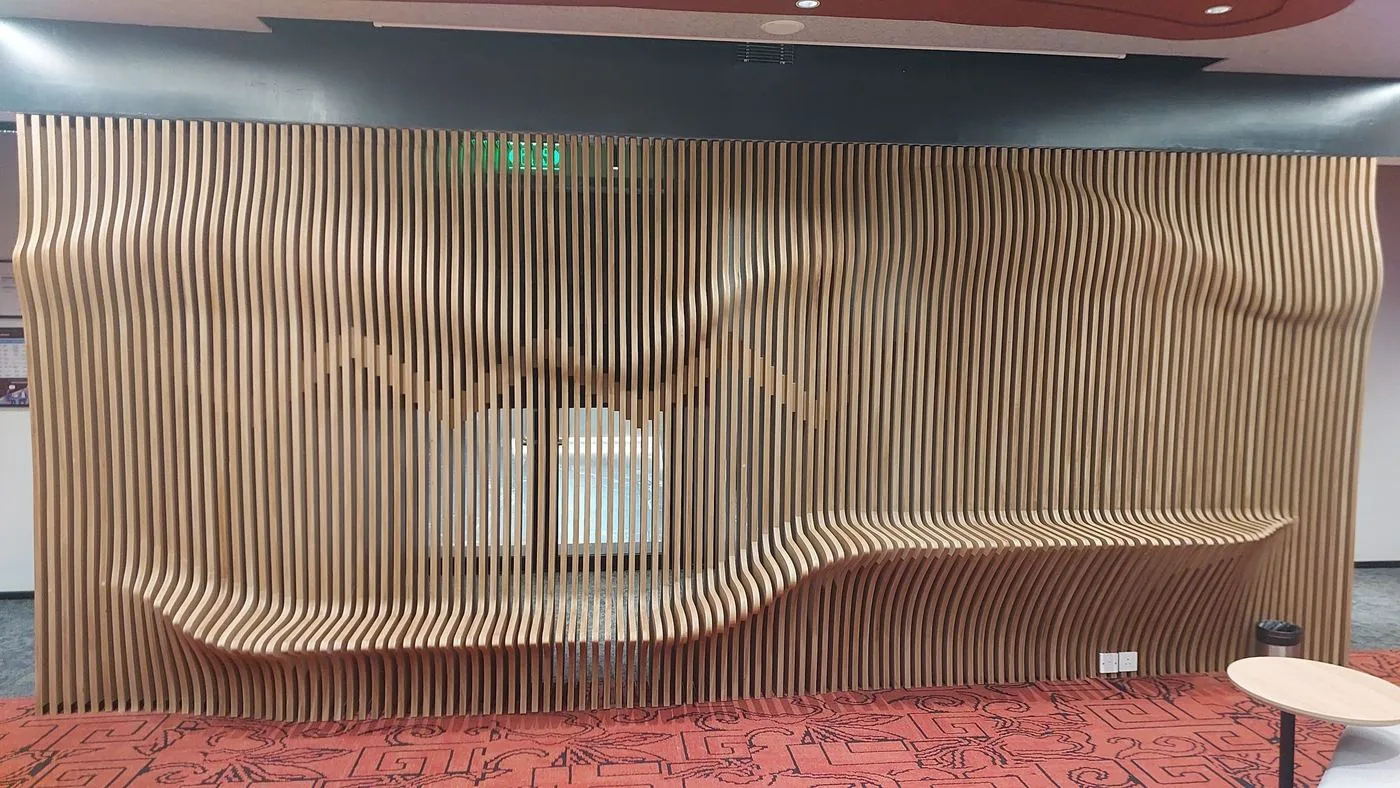 Sculpted timber fin wall with built-in seating at the IntraEdge office